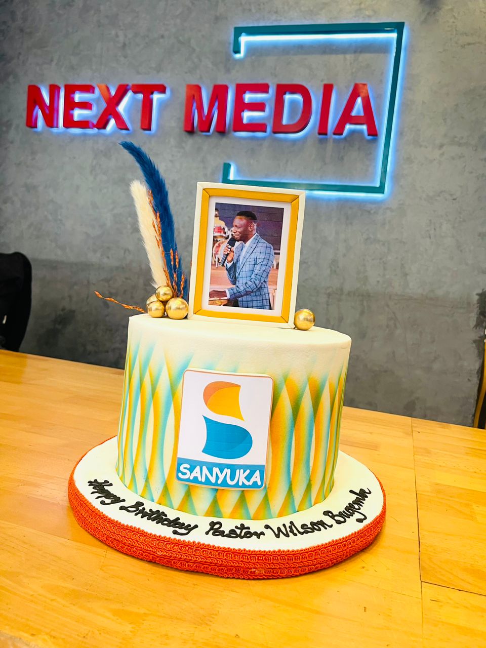 Sanyuka TV's Uncut team surprises Pastor Bugembe with a birthday cake