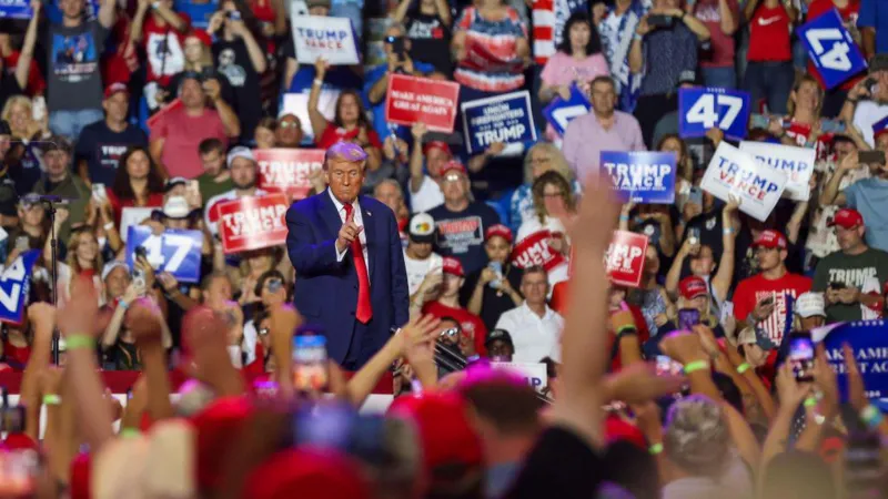 Trump rushed to safety and suspect held after man spotted with rifle