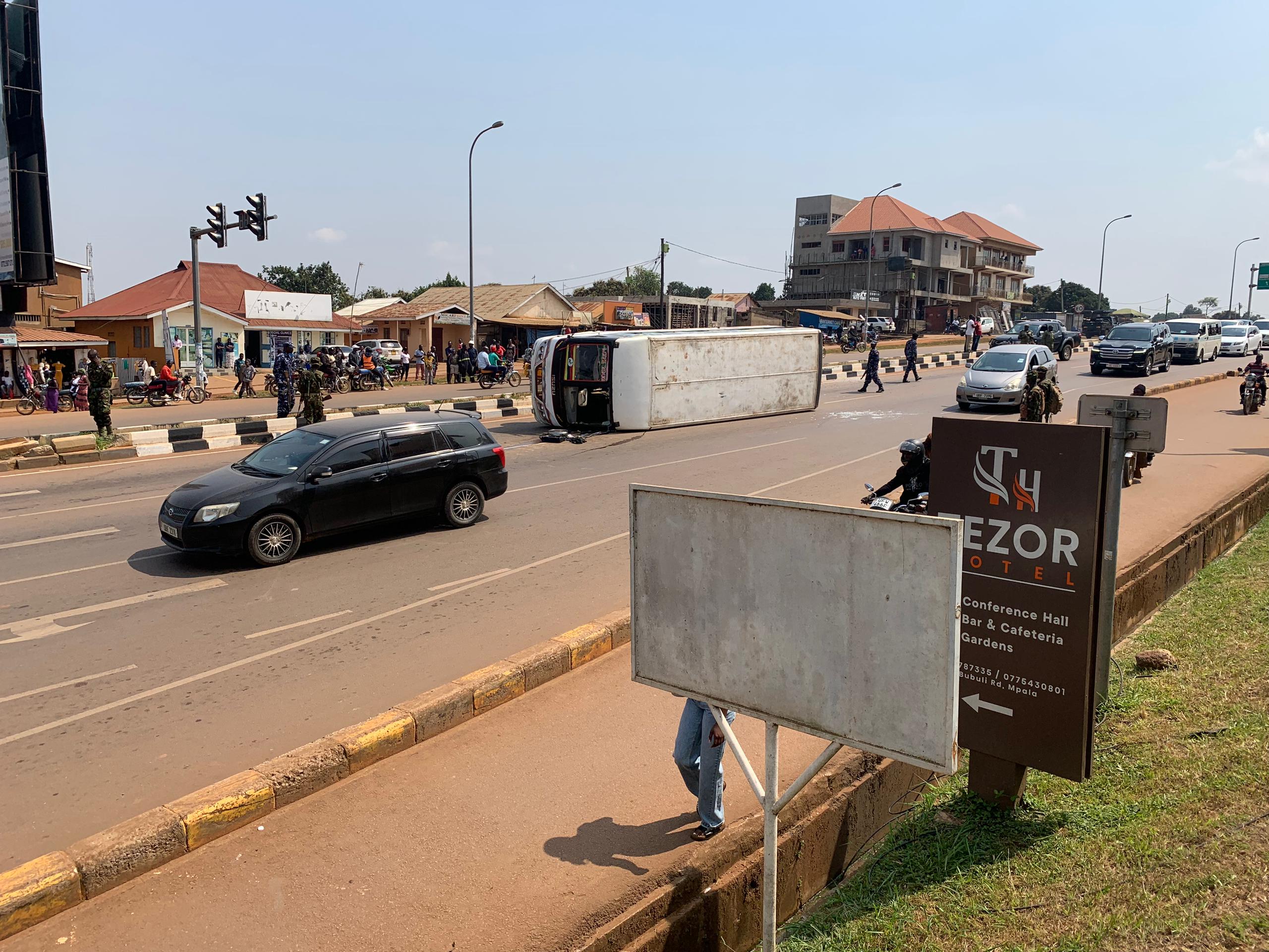 Students, teacher injured as school bus overturns at Nkumba traffic lights in Entebbe