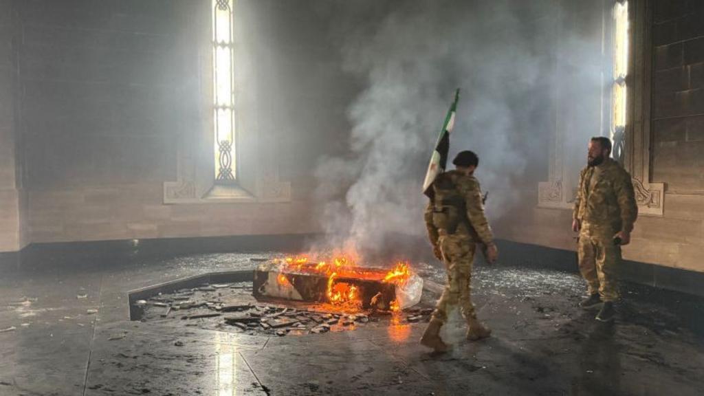 Syrian rebel fighters set fire to tomb of Bashar al-Assad's father