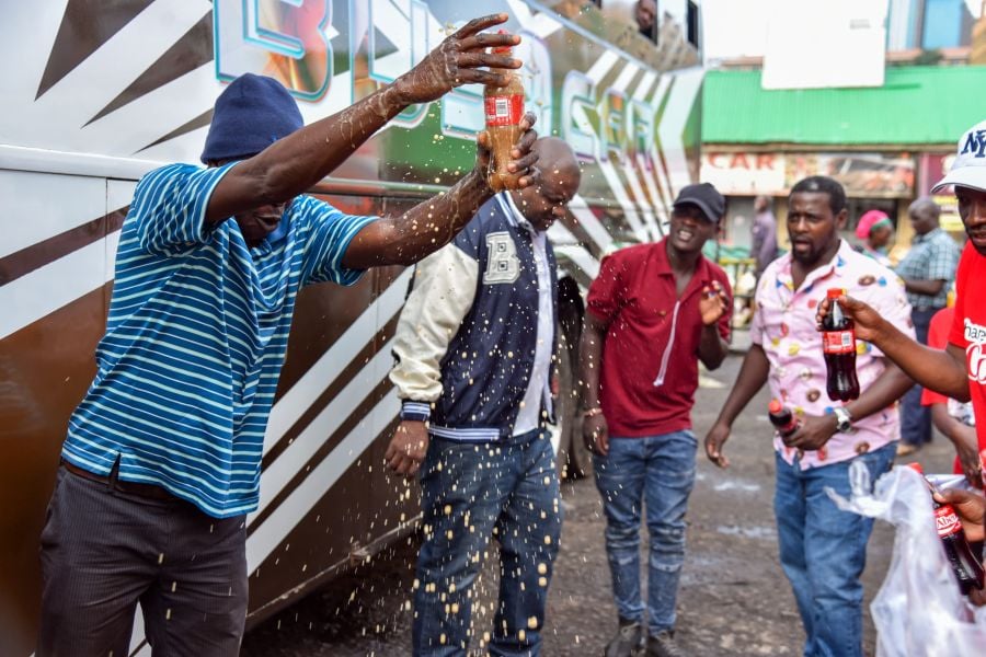 Coca Cola Shares Joy With Travelers in Namayiba Bus Park