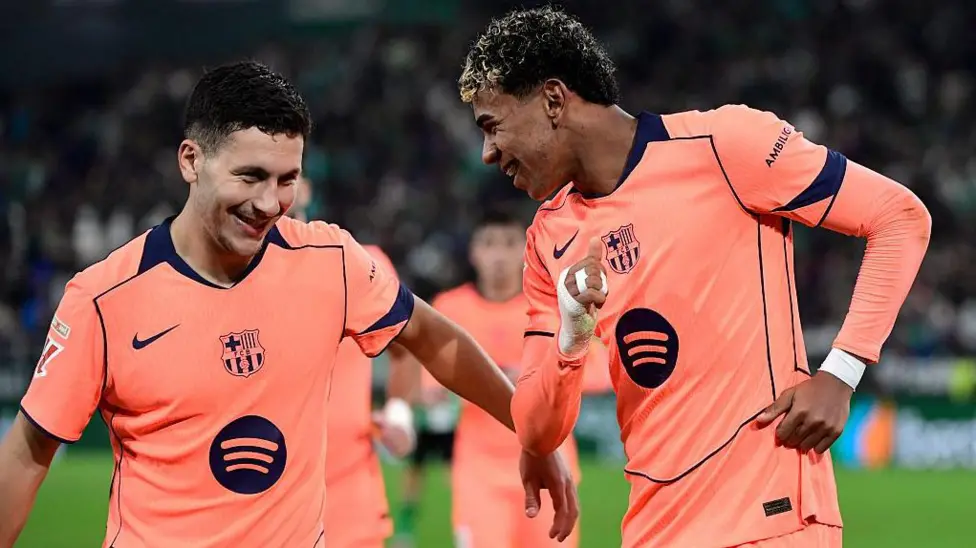 Leaders Barcelona hit five against Real Betis