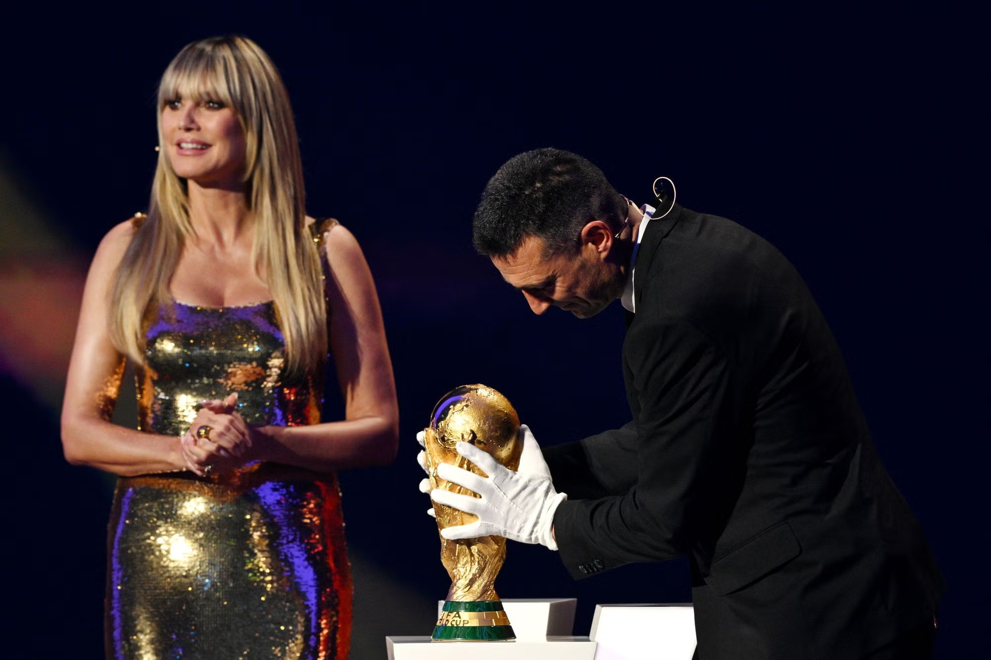 Fifa apologises for making Argentina’s World Cup-winning coach wear gloves to touch trophy