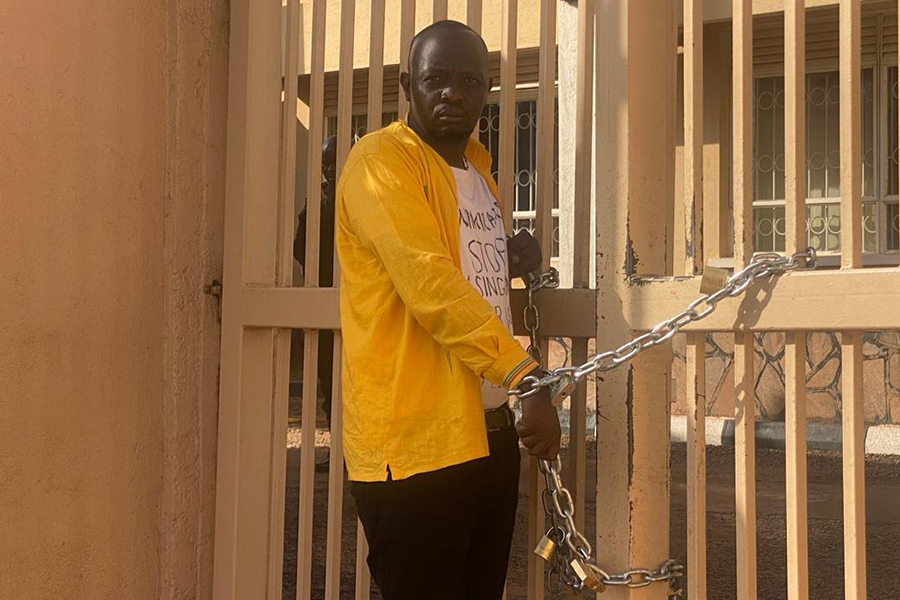 MP Race: Man Chains Himself to Uneb Gate Over Academic Documents