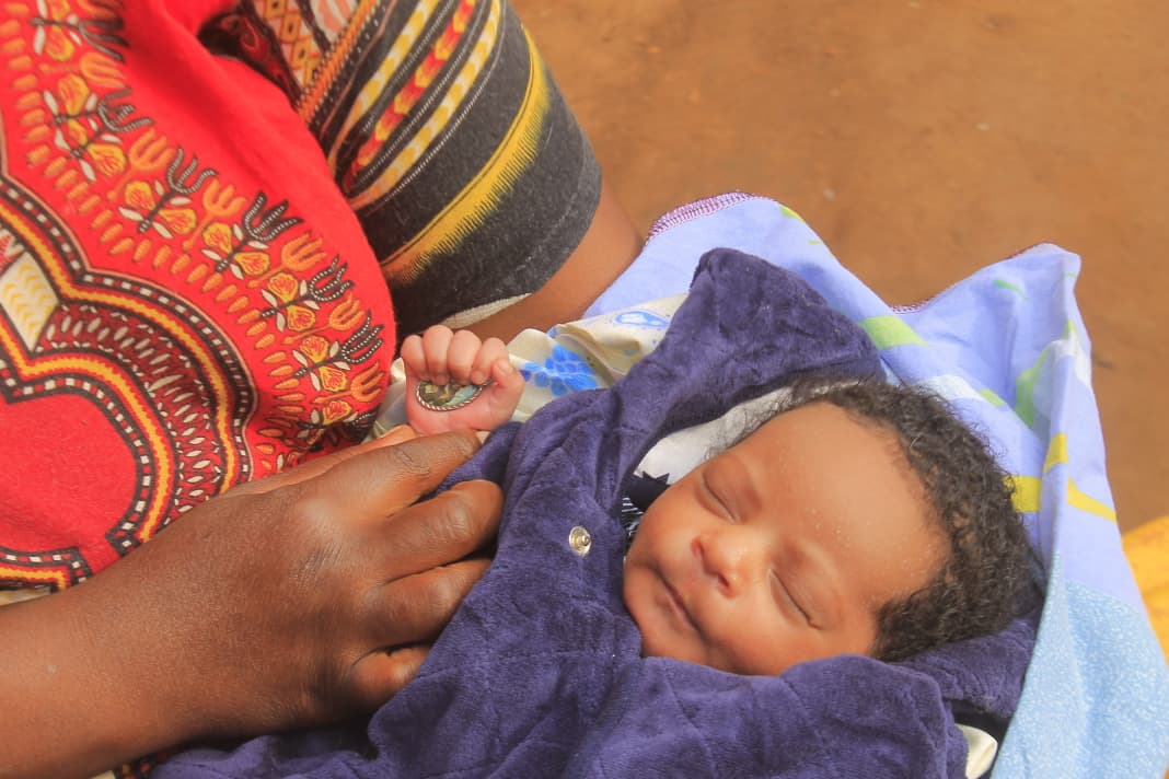 Gomba Residents Hail Baby Born Holding Devotion Medal as Jesus