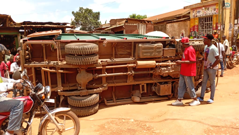 Boda Rider Injured as Truck Overturns on Pothole-Ridden Nansana Road