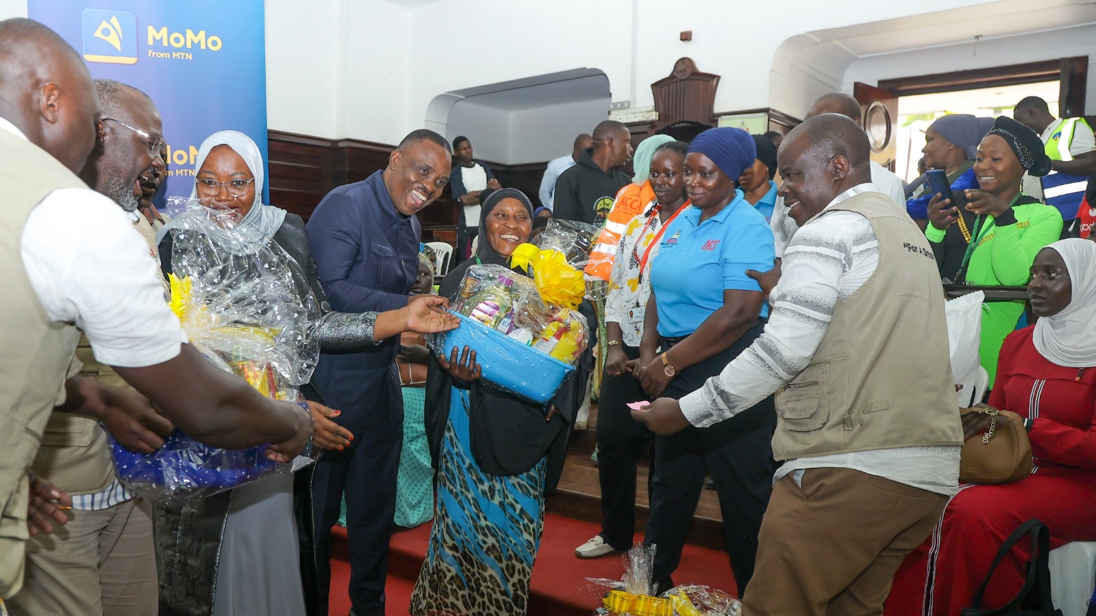 MTN MoMo, KCCA Donate Ramadhan Hampers to Women Road Workers, Luzira Inmates
