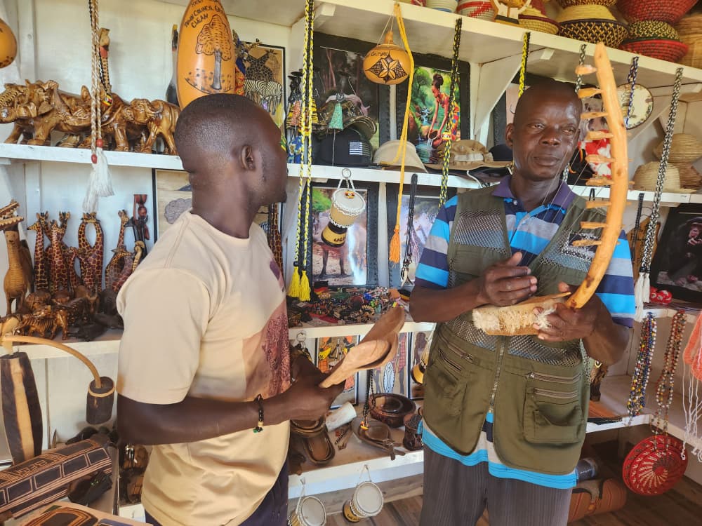 Pakwach Art and Craft Association members at their craft shop at Tangi gate of Marchison game park.