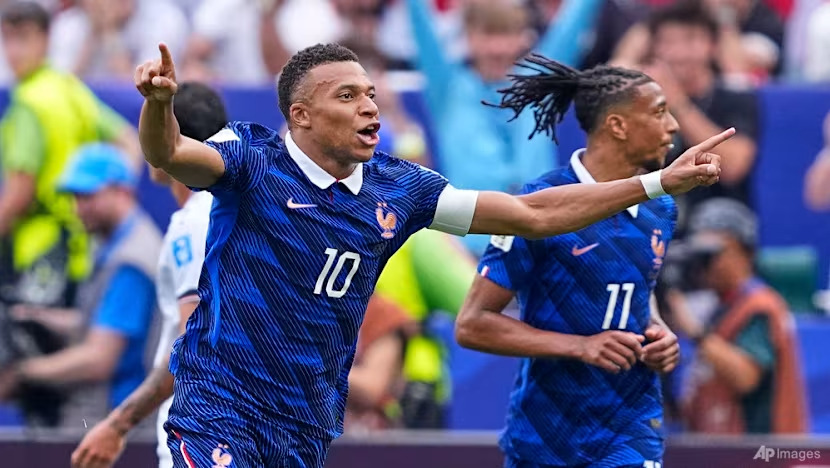 Mbappe double as France beat Iraq after two-hour delay