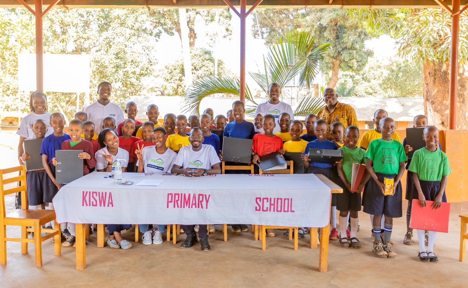 Mogo Uganda Donates Furniture, Learning Materials to Kiswa Primary School in Bugolobi