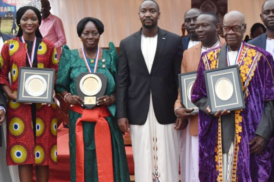 Abenakyo (left), Kadaga (second left) and the late Mutengu display their awards alongside the Kyabazinga in 2019