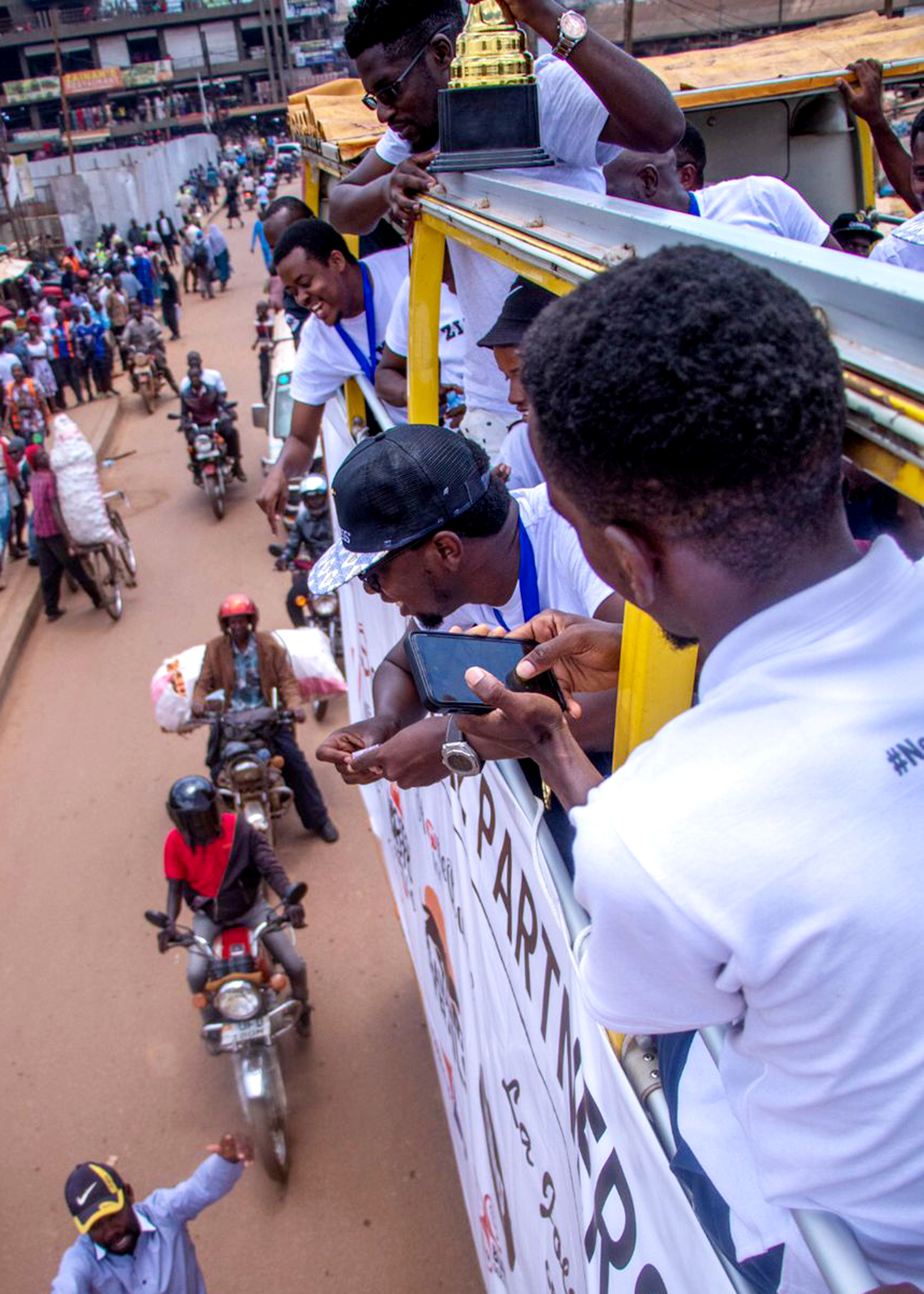 SMACK old students 'ground' Kampala with open-top bus trophy parade