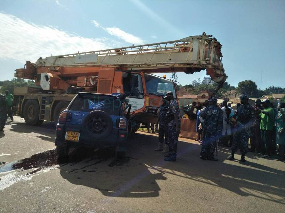Woman rams car into Crane, dies