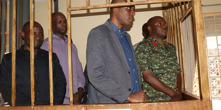 Senior police officers Muhangi, Ndahura, five others charged together with Kayihura by army court