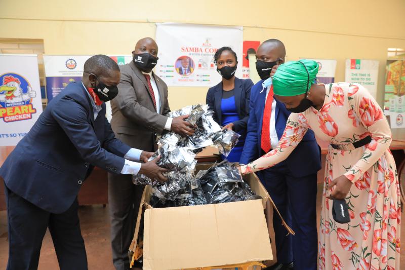 UAP Old Mutual donates Shs 10 million to purchase Covid-19 face masks in Nakawa