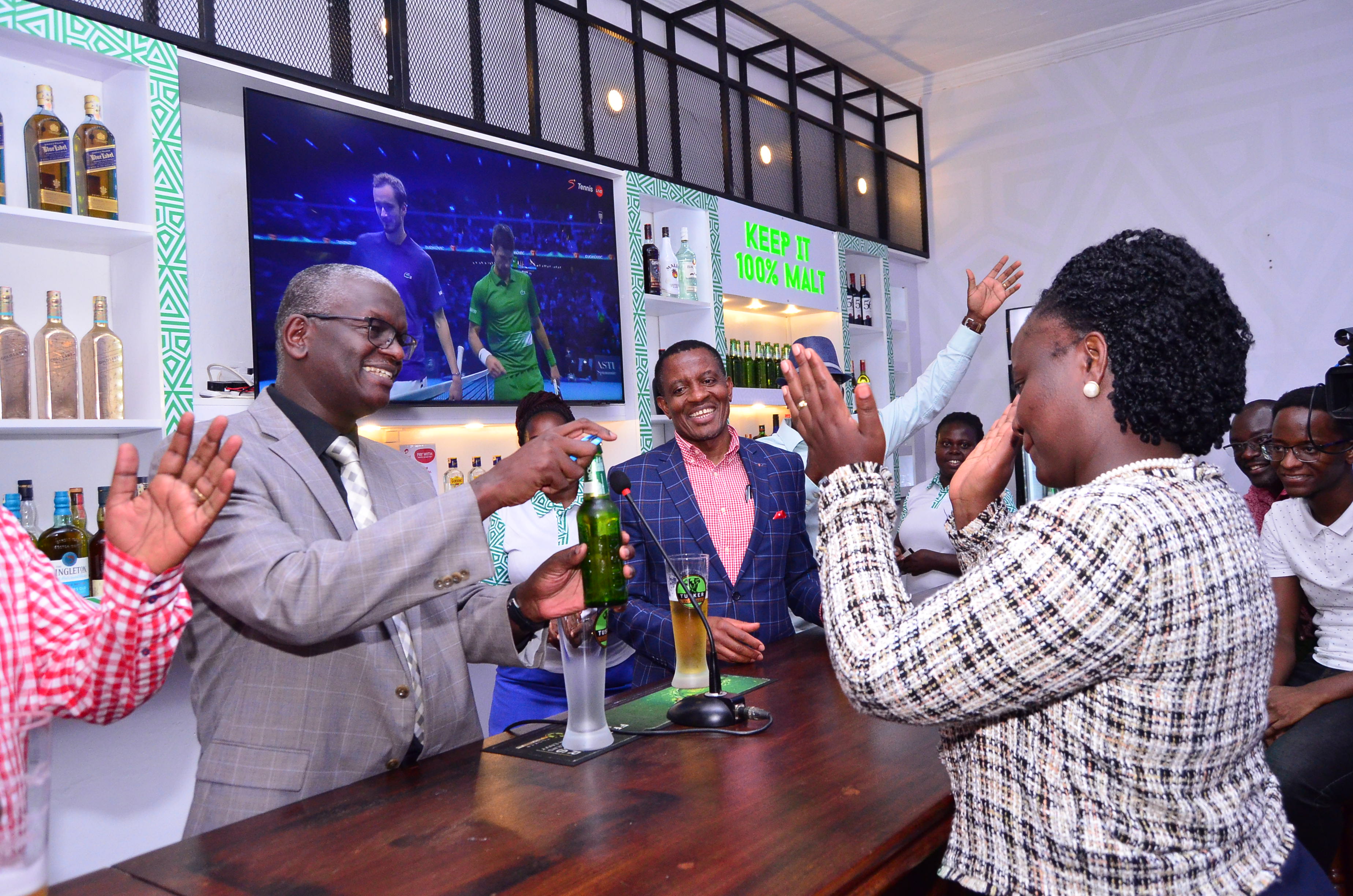 UBL MD Kilonzo takes up bartender duties in inclusivity gesture as Tusker Malt Bar is launched at Kampala Club