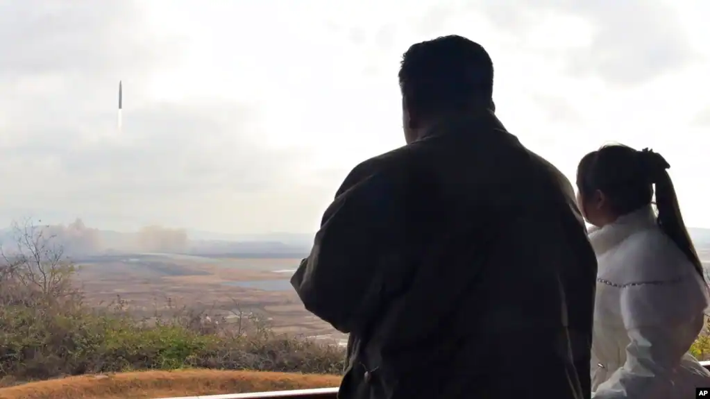 Secretive leader shows off daughter as he launches another deadly missile