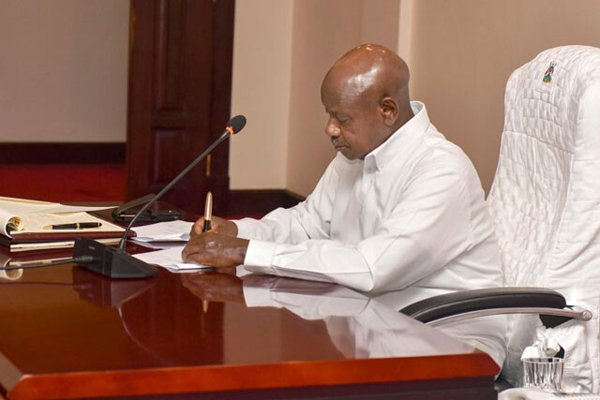 Museveni signs five bills into law