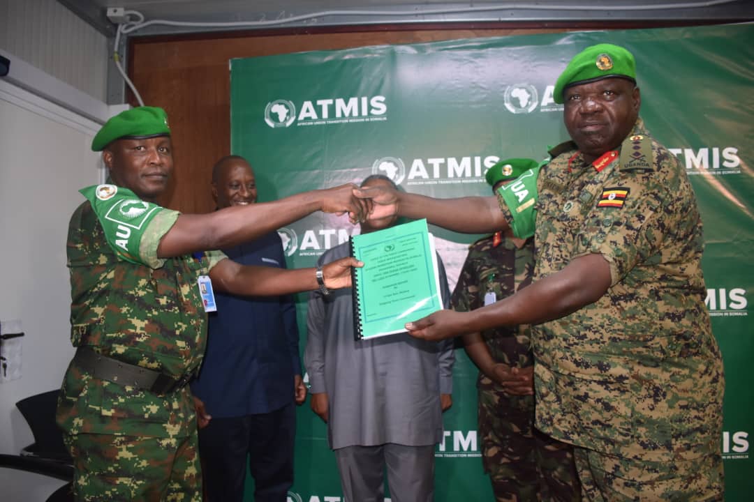 Featured image for Gen Okiding hands over ATMIS, returns to Uganda as deputy CDF