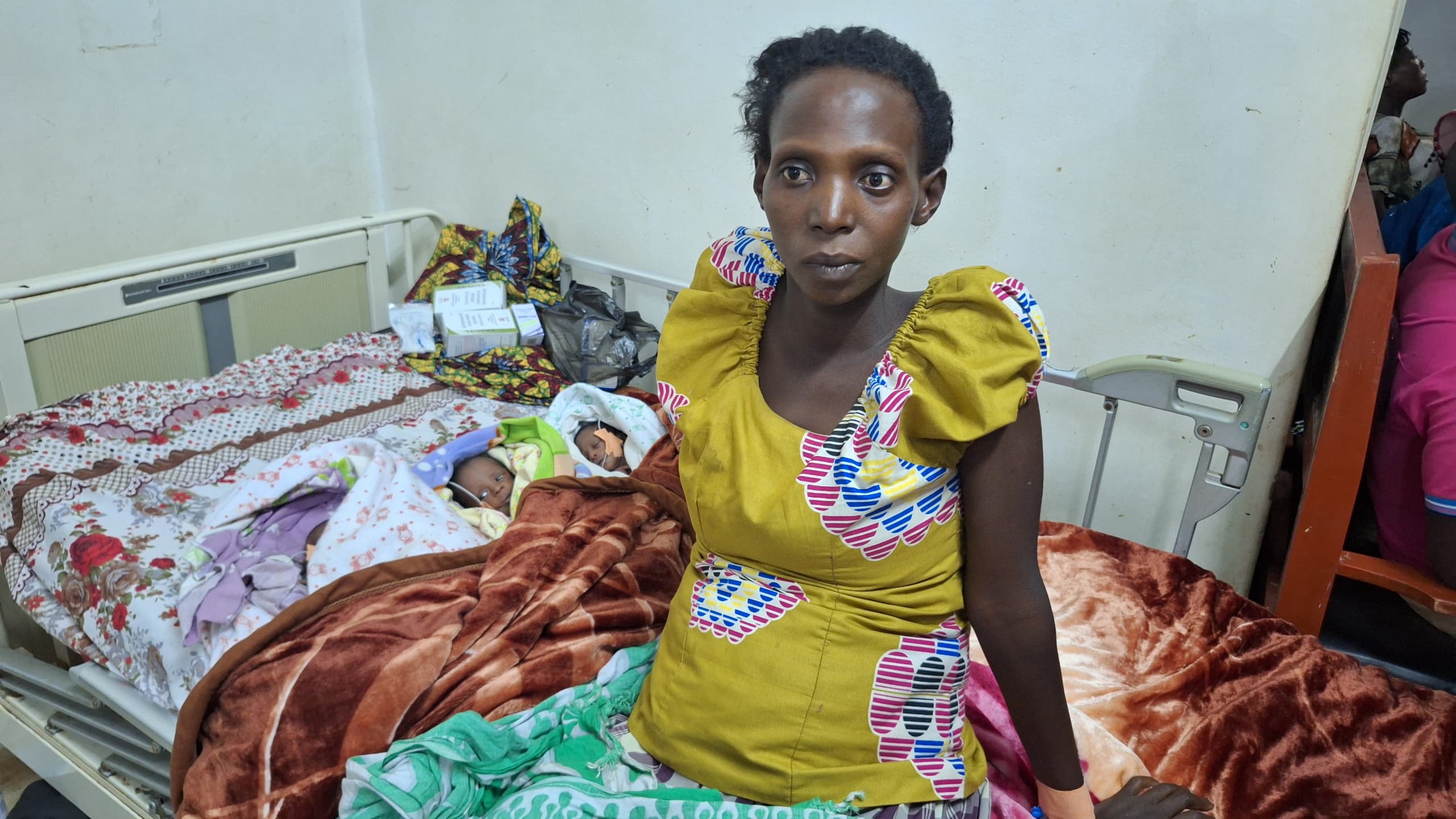 Woman Struggles with Three Newborns in Mubende